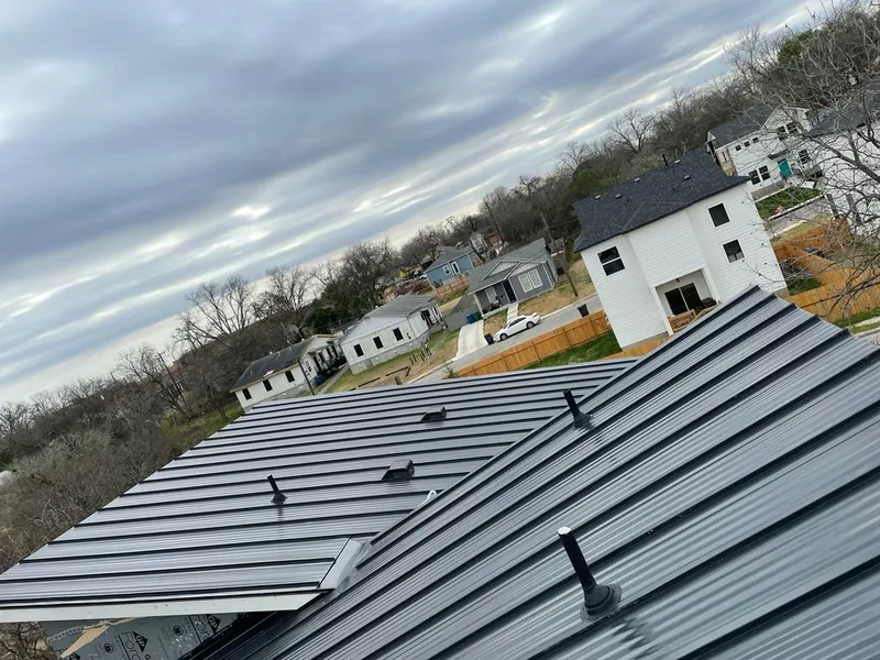 Standing seam metal roof panels with vents for Skylight Repair in Narragansett